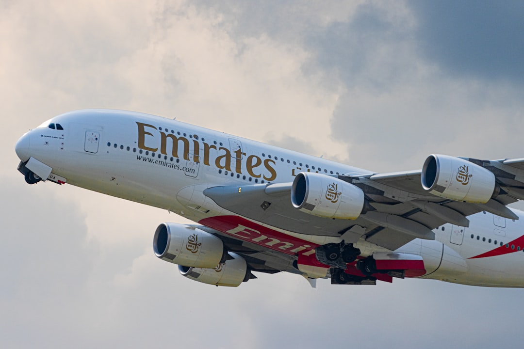 white-and-red-passenger-plane-in-the-sky-yzrgakpbxjq
